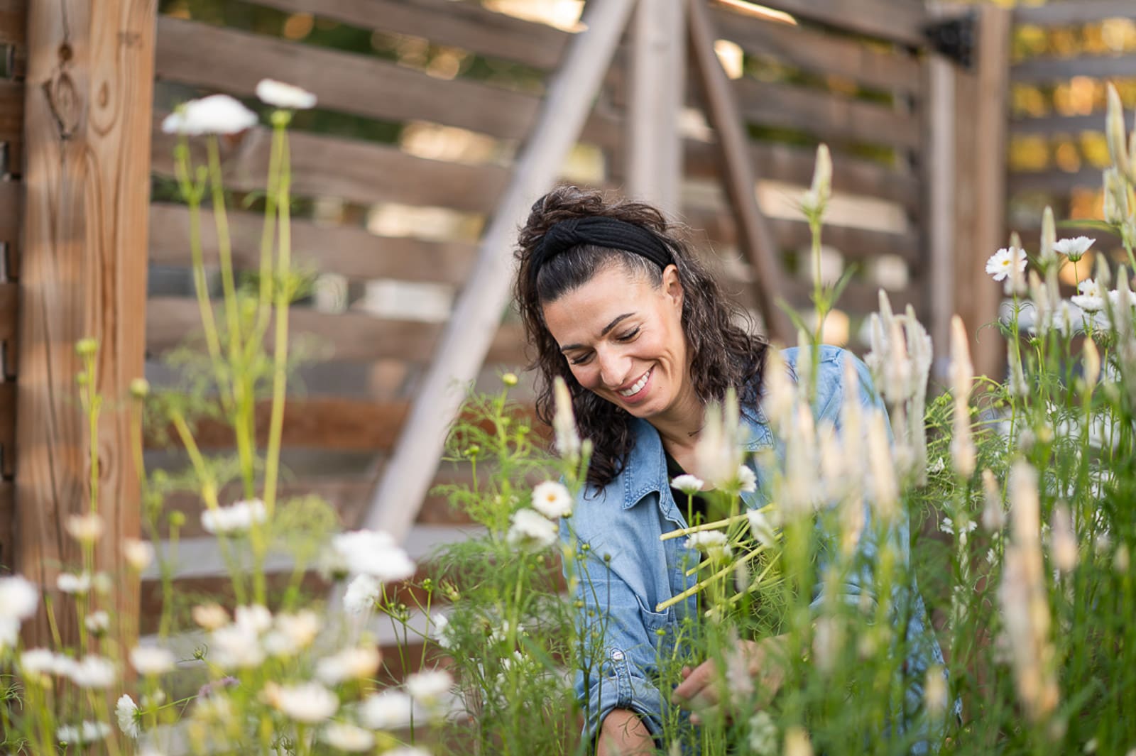 woman smiling and working in her garden during brand photography photo shoot