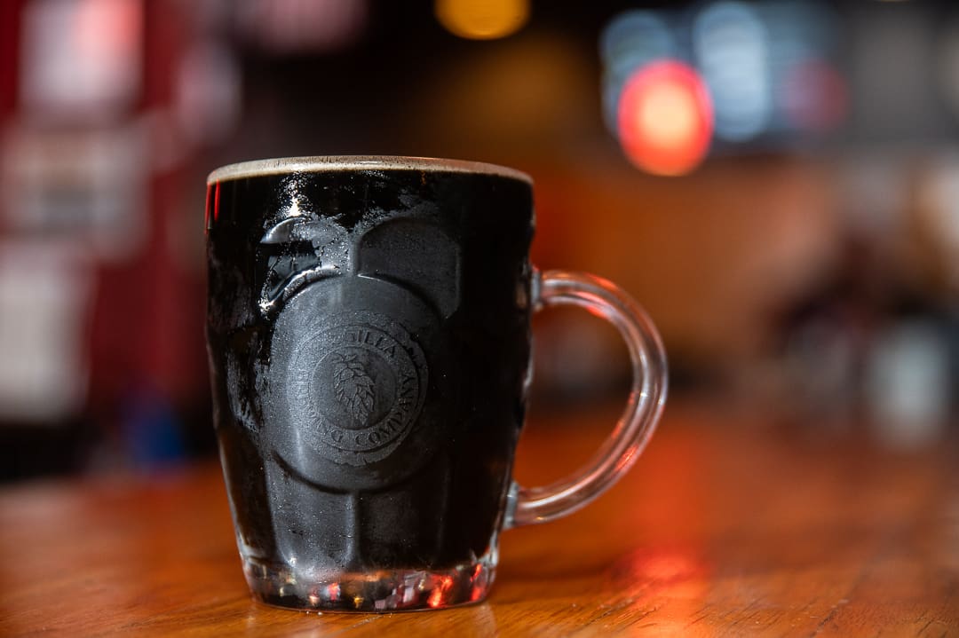 dark lager in a glass mug on counter at Argilla brewery