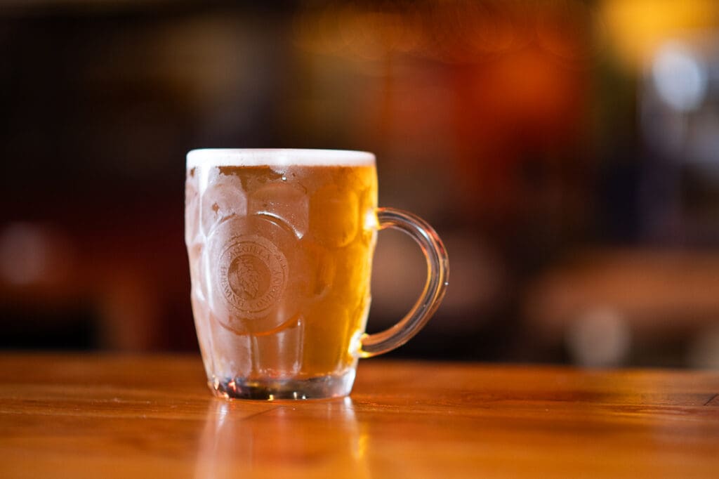 kolsch in a glass mug with argilla brewing company etched onto the front